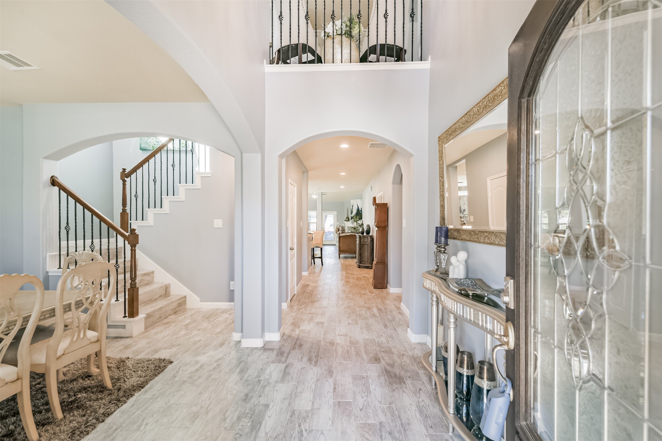 24047 Schults Meadow Lane Spring, TX 77389 - Photo 4 of 47 a view of entryway and hall with wooden floor
