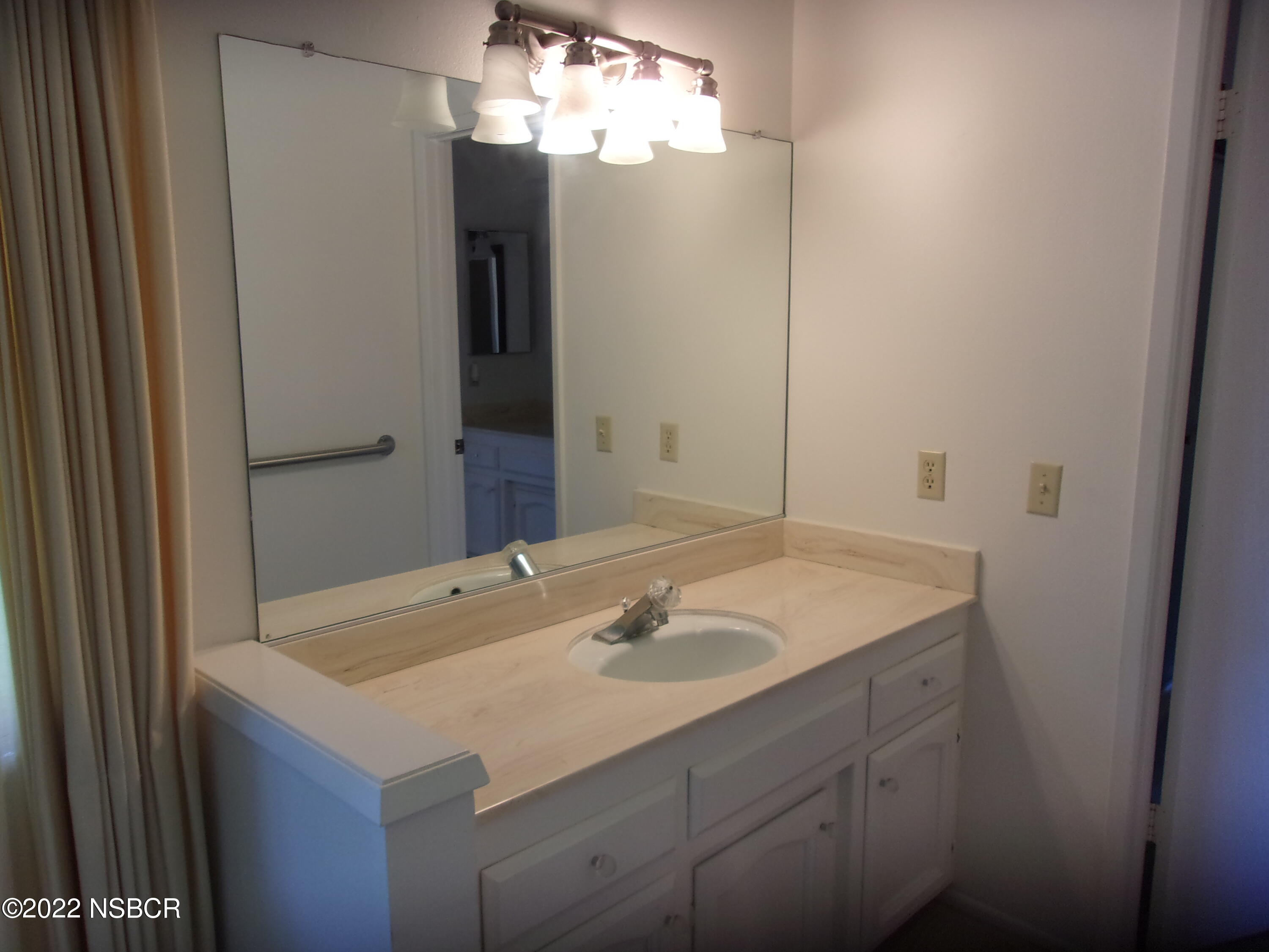 142 Oak Hill Drive Lompoc, CA 93436 - Photo 8 of 23 a bathroom with a sink and a mirror