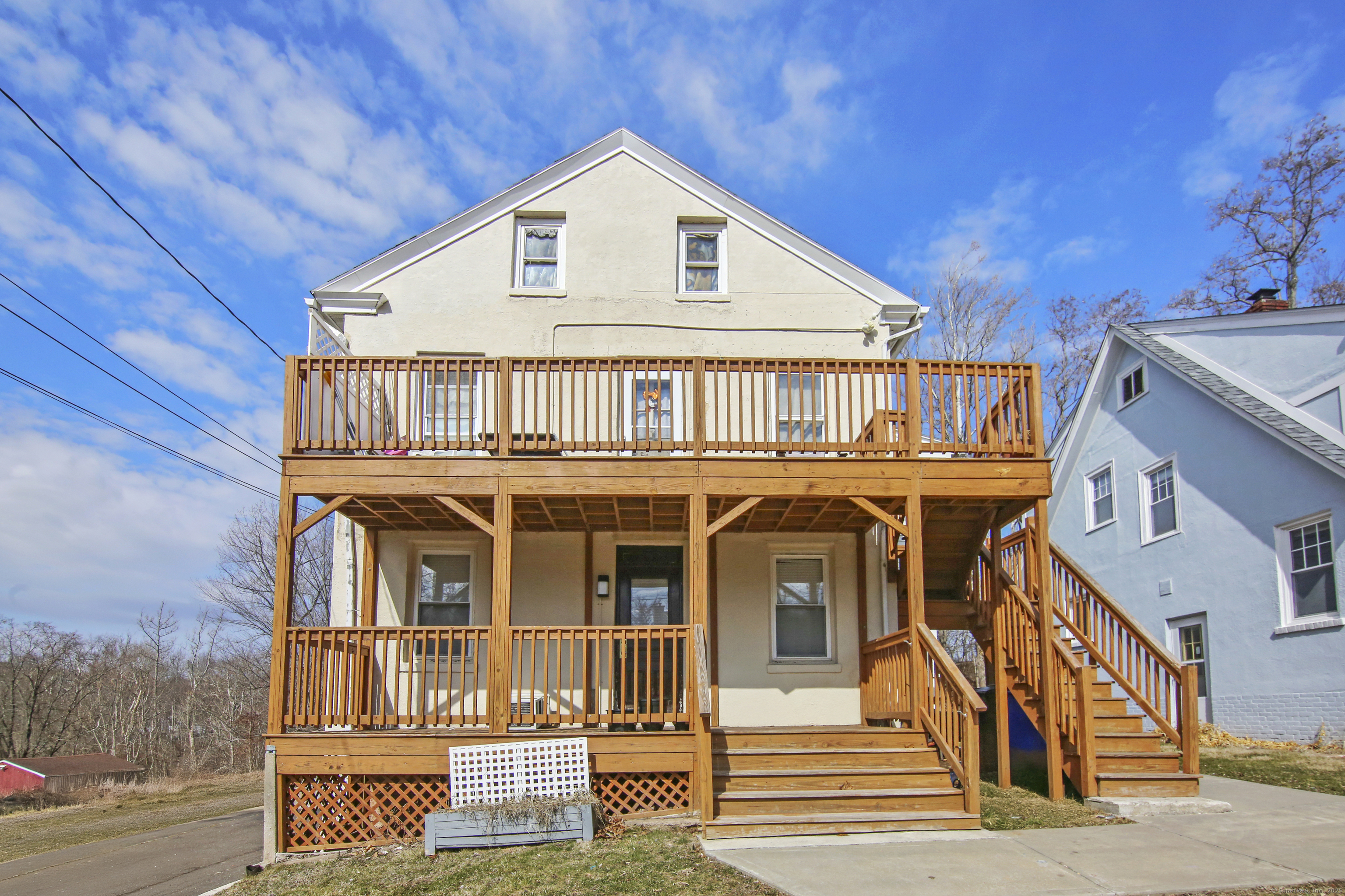 a view of a house with wooden fence