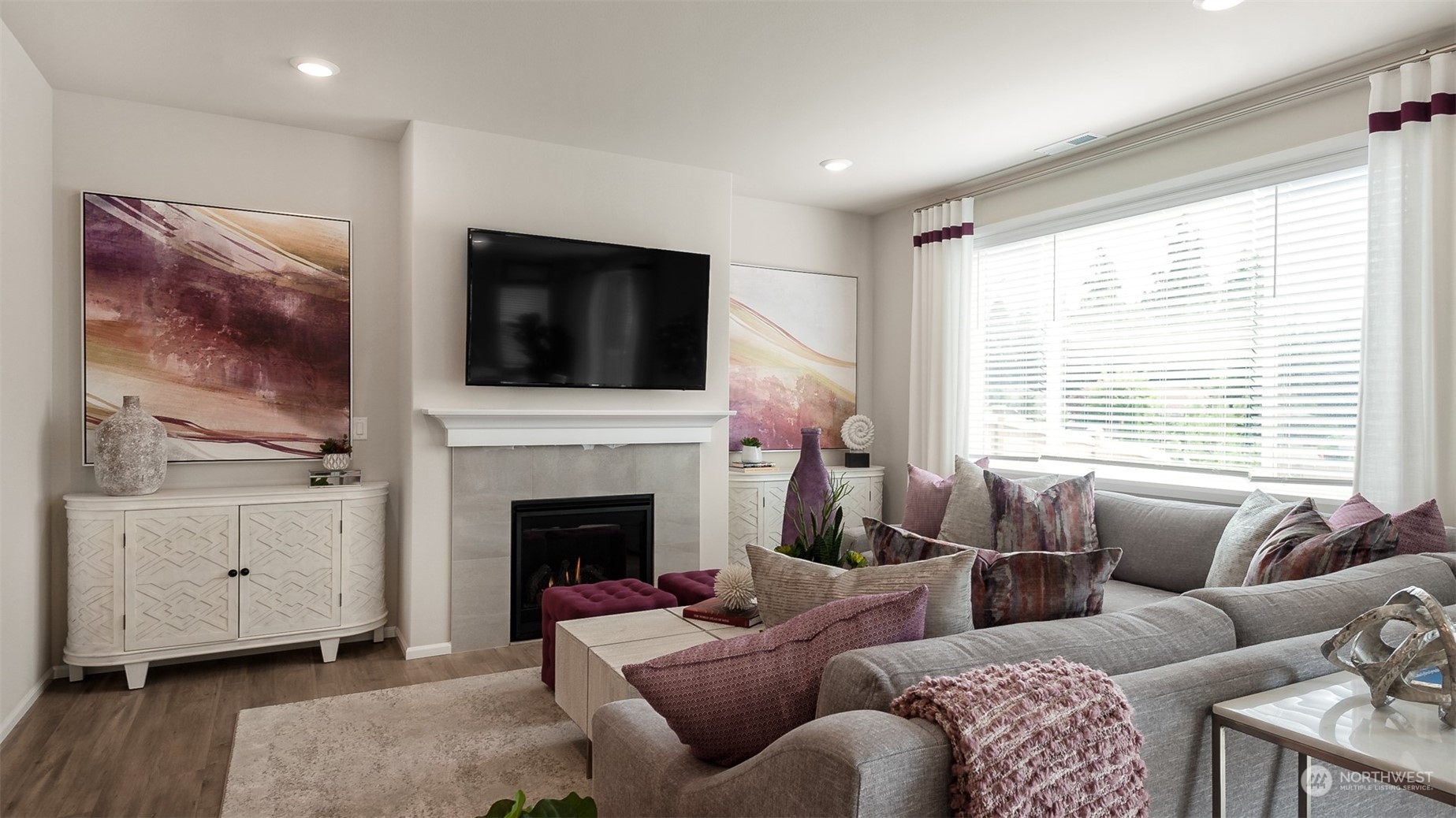 4010 233rd Street Southeast, Unit 78 Bothell, WA 98021 - Photo 9 of 18 a living room with furniture a flat screen tv and a fireplace
