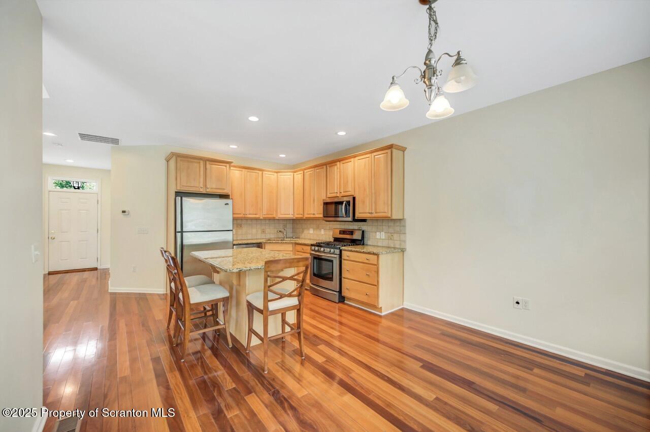 2303 Browning Cl Moosic, PA 18507 - Photo 16 of 71 a view of a dining room with furniture and wooden floor