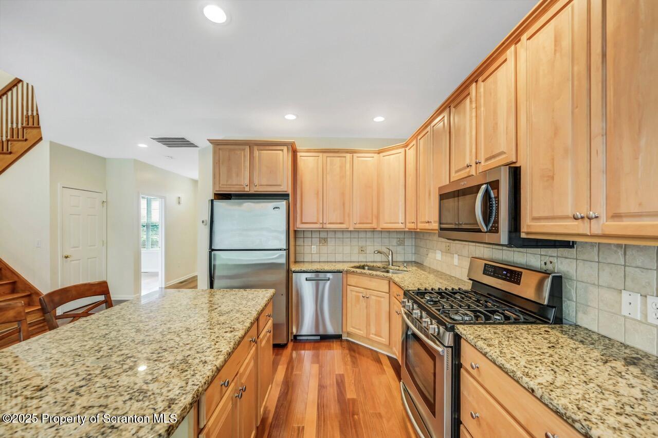 2303 Browning Cl Moosic, PA 18507 - Photo 19 of 71 a kitchen with a stove a sink and a refrigerator