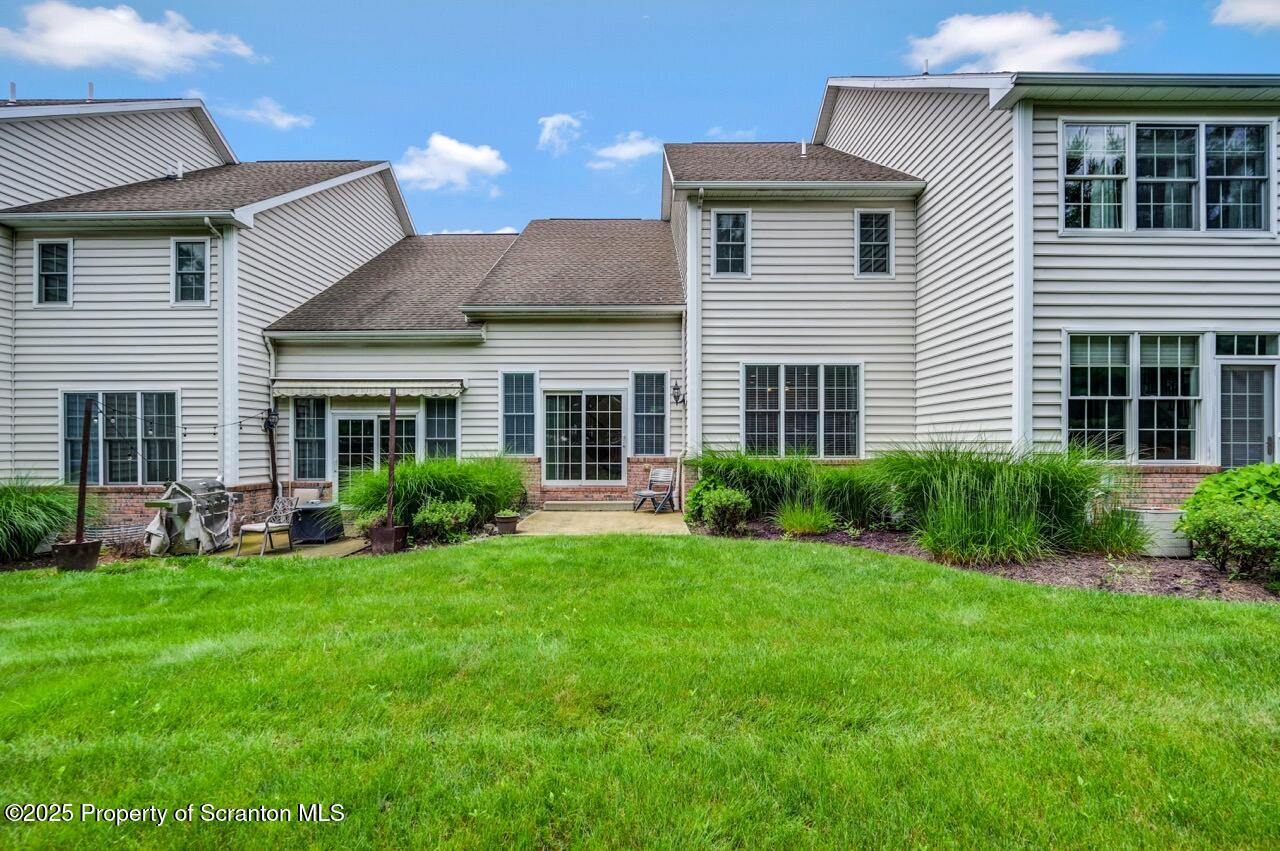 2303 Browning Cl Moosic, PA 18507 - Photo 2 of 71 a front view of a house with a yard and porch