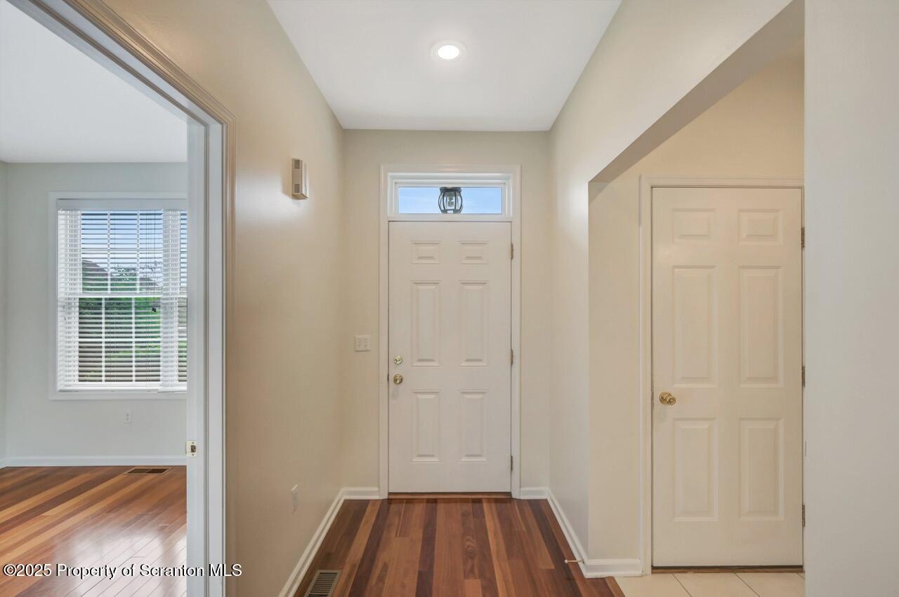 2303 Browning Cl Moosic, PA 18507 - Photo 24 of 71 a view of a hallway with wooden floor and closet