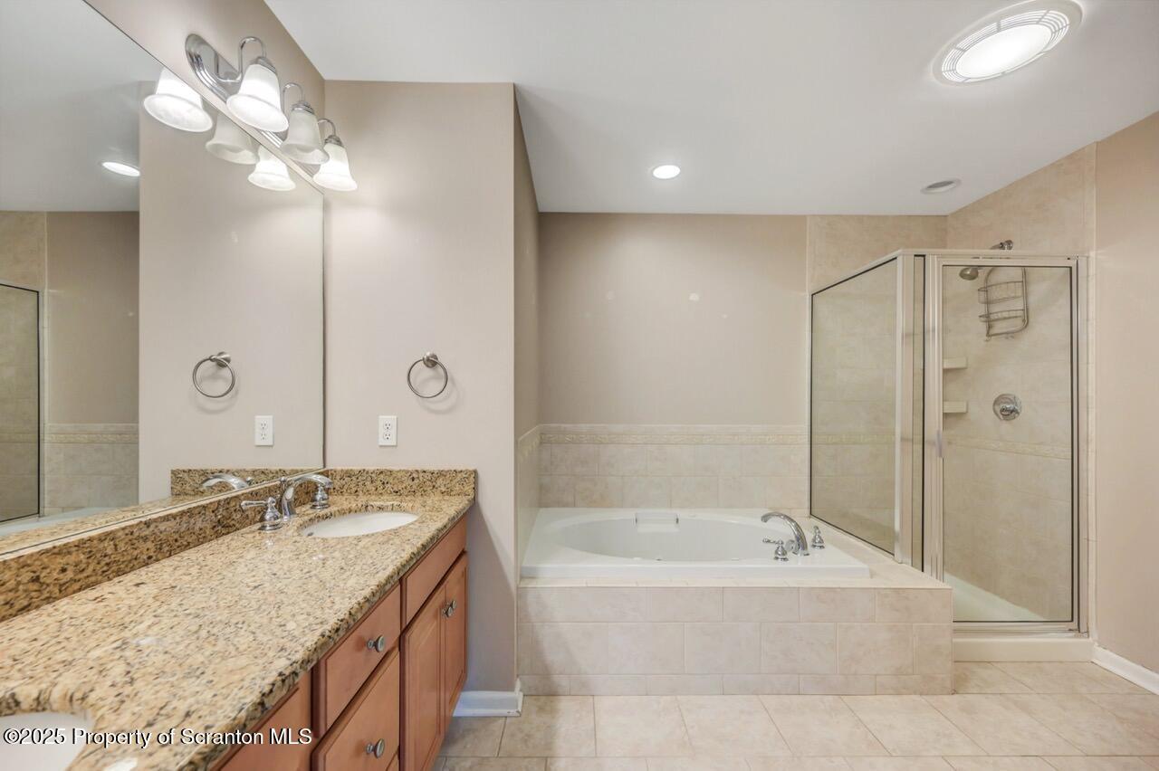 2303 Browning Cl Moosic, PA 18507 - Photo 39 of 71 a bathroom with a granite countertop tub a shower and a sink
