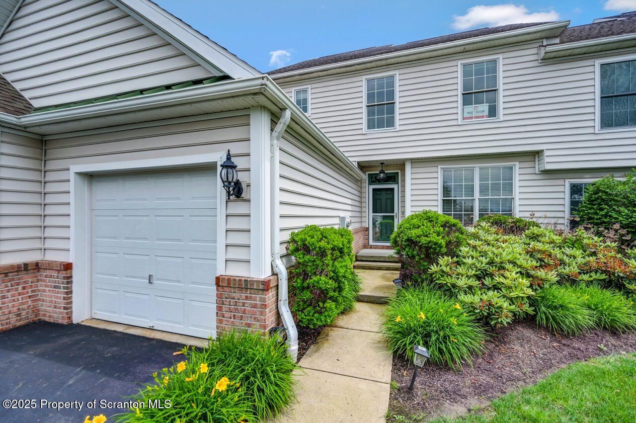 2303 Browning Cl Moosic, PA 18507 - Photo 4 of 71 a front view of a house with garden