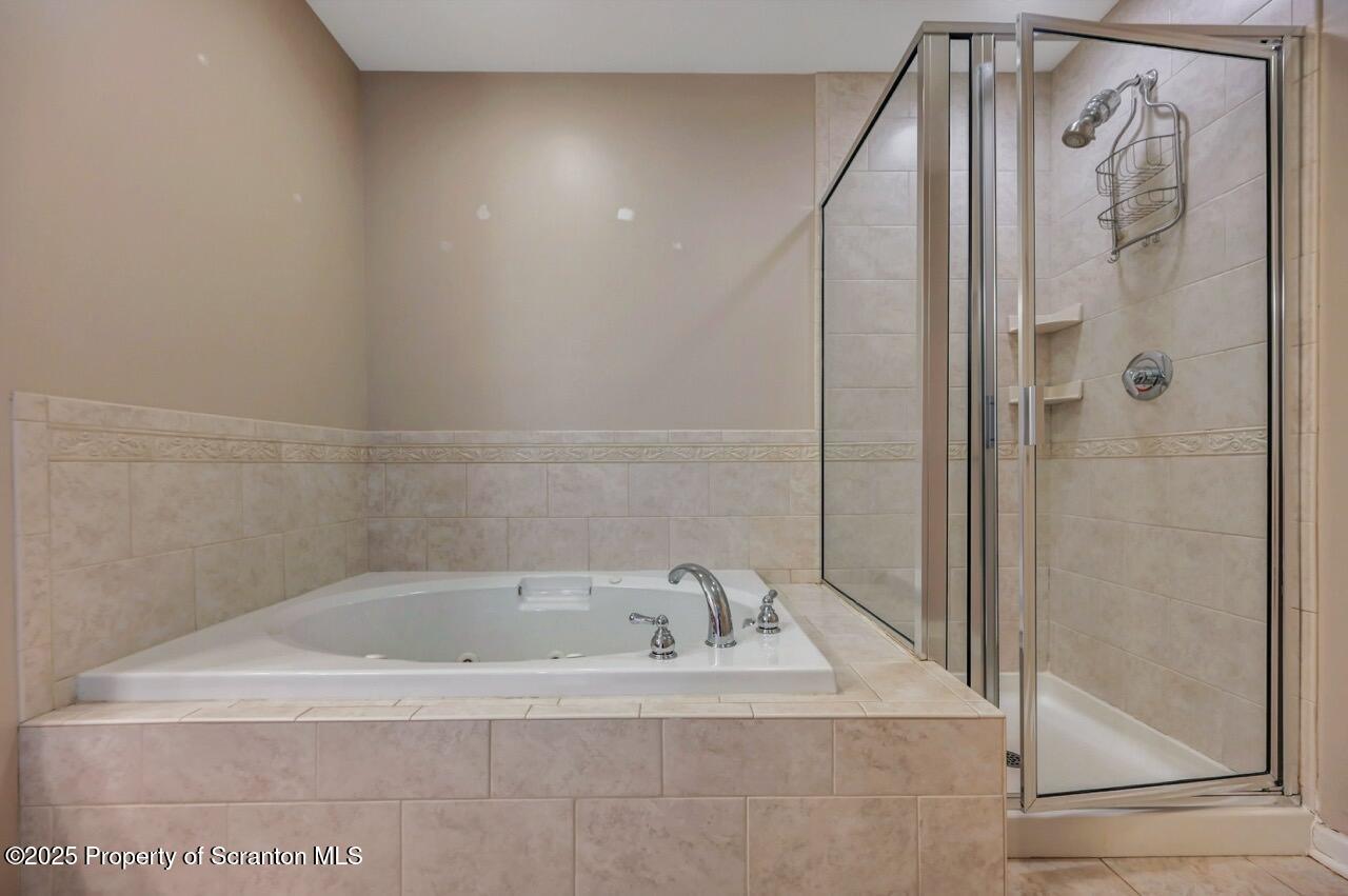2303 Browning Cl Moosic, PA 18507 - Photo 42 of 71 a bathroom with a bathtub and shower