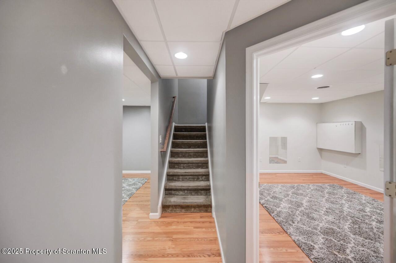 2303 Browning Cl Moosic, PA 18507 - Photo 50 of 71 a view of hallway with stairs and wooden floor
