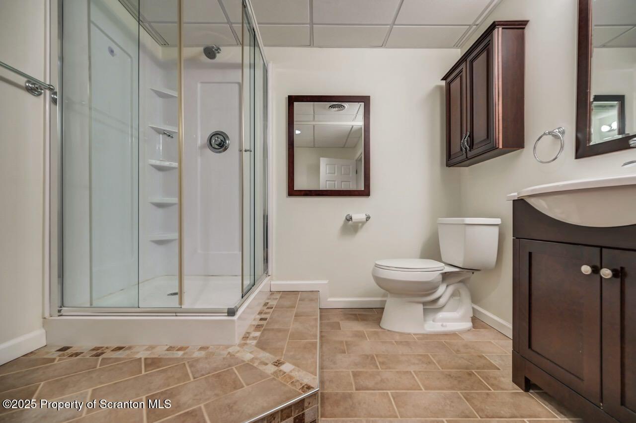 2303 Browning Cl Moosic, PA 18507 - Photo 59 of 71 a bathroom with a toilet sink and shower