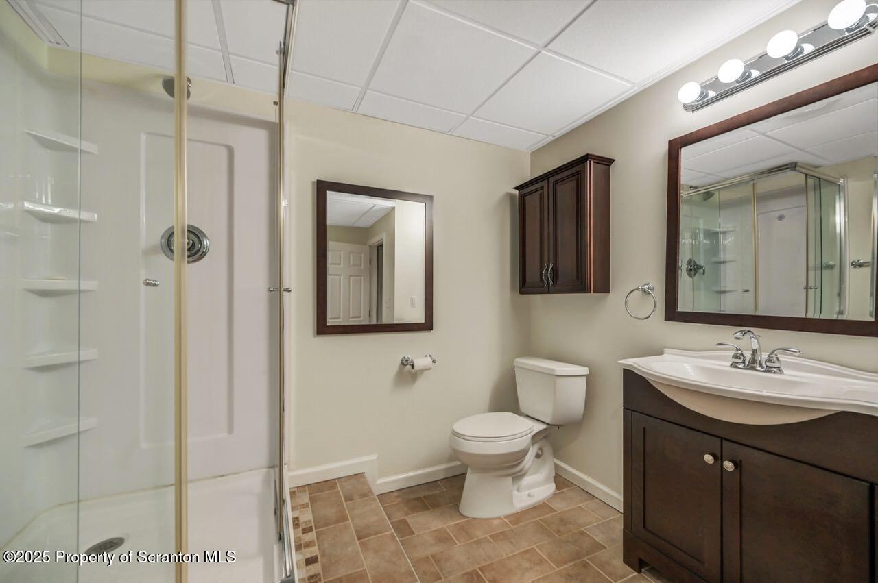 2303 Browning Cl Moosic, PA 18507 - Photo 60 of 71 a bathroom with a toilet a sink and mirror