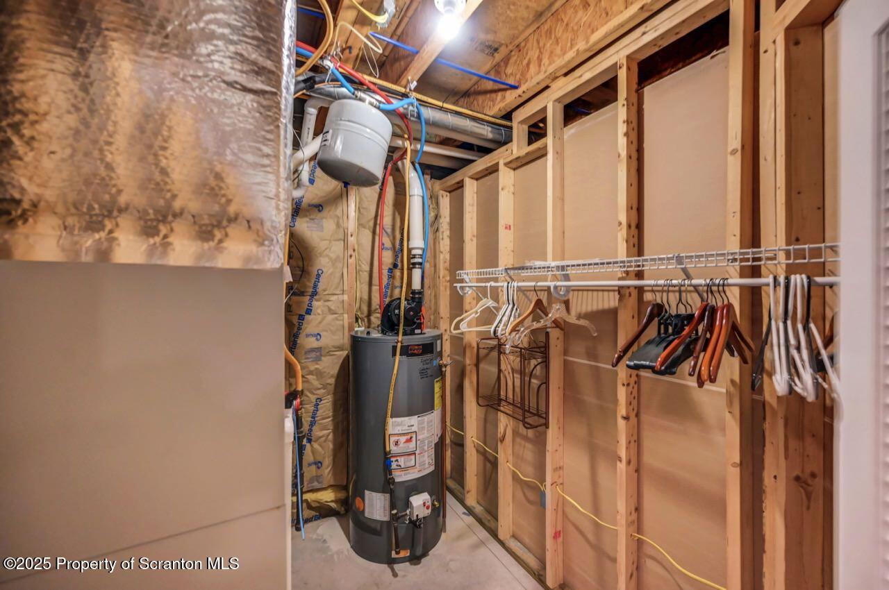 2303 Browning Cl Moosic, PA 18507 - Photo 66 of 71 a view of walk in closet with clothes and shoes