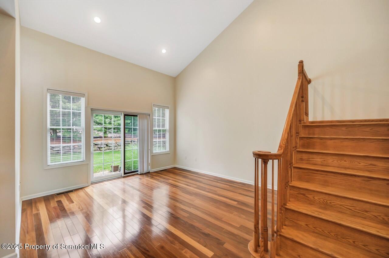 2303 Browning Cl Moosic, PA 18507 - Photo 8 of 71 a view of empty room with wooden floor and fan