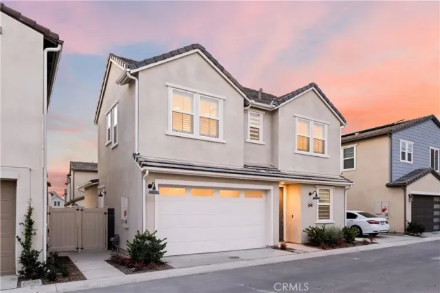 a front view of a house with a garage