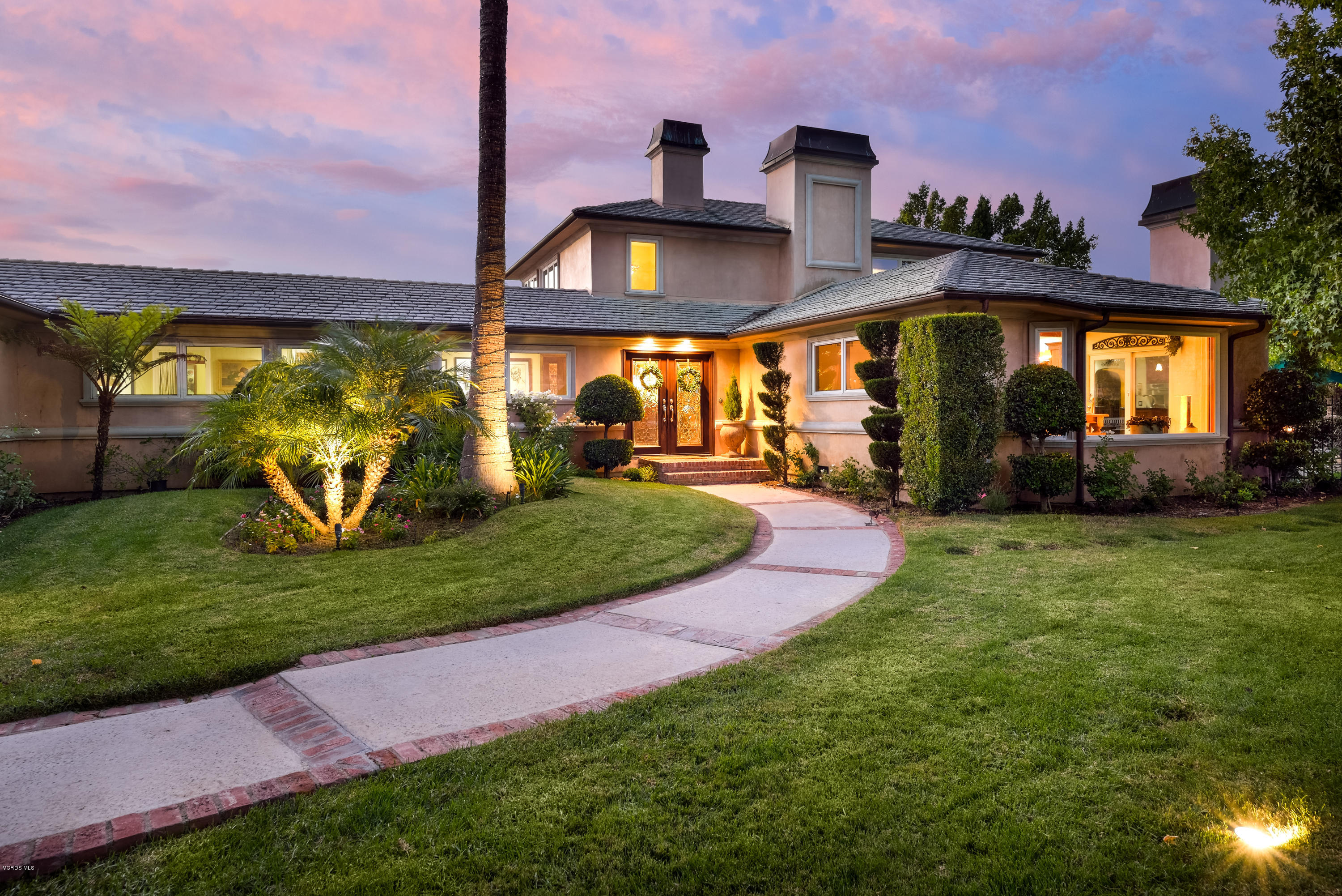 24353 Dry Canyon Cold Creek Road Calabasas, CA 91302 - Photo 1 of 36 a front view of a house with a yard