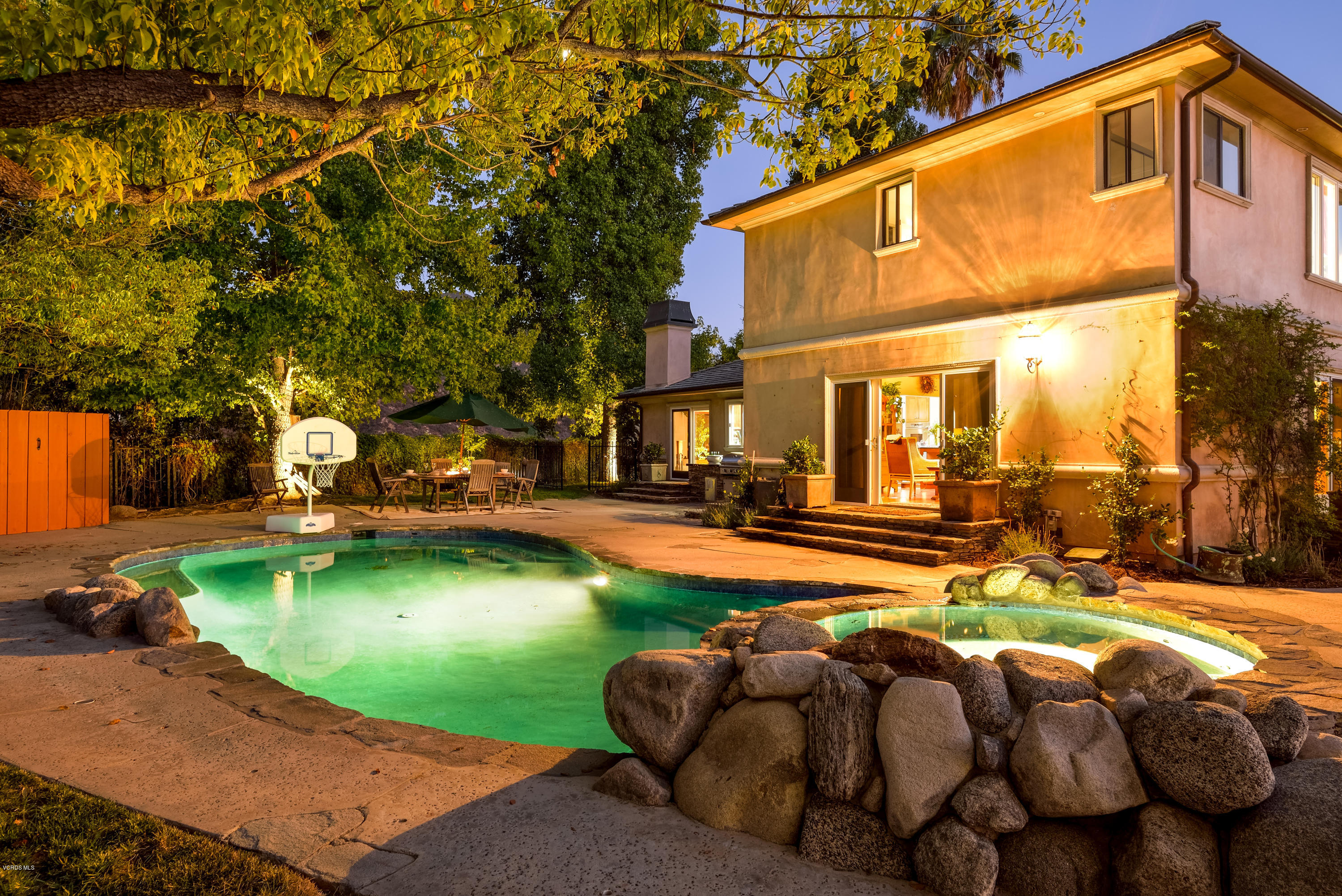 24353 Dry Canyon Cold Creek Road Calabasas, CA 91302 - Photo 2 of 36 a swimming pool with outdoor seating and yard
