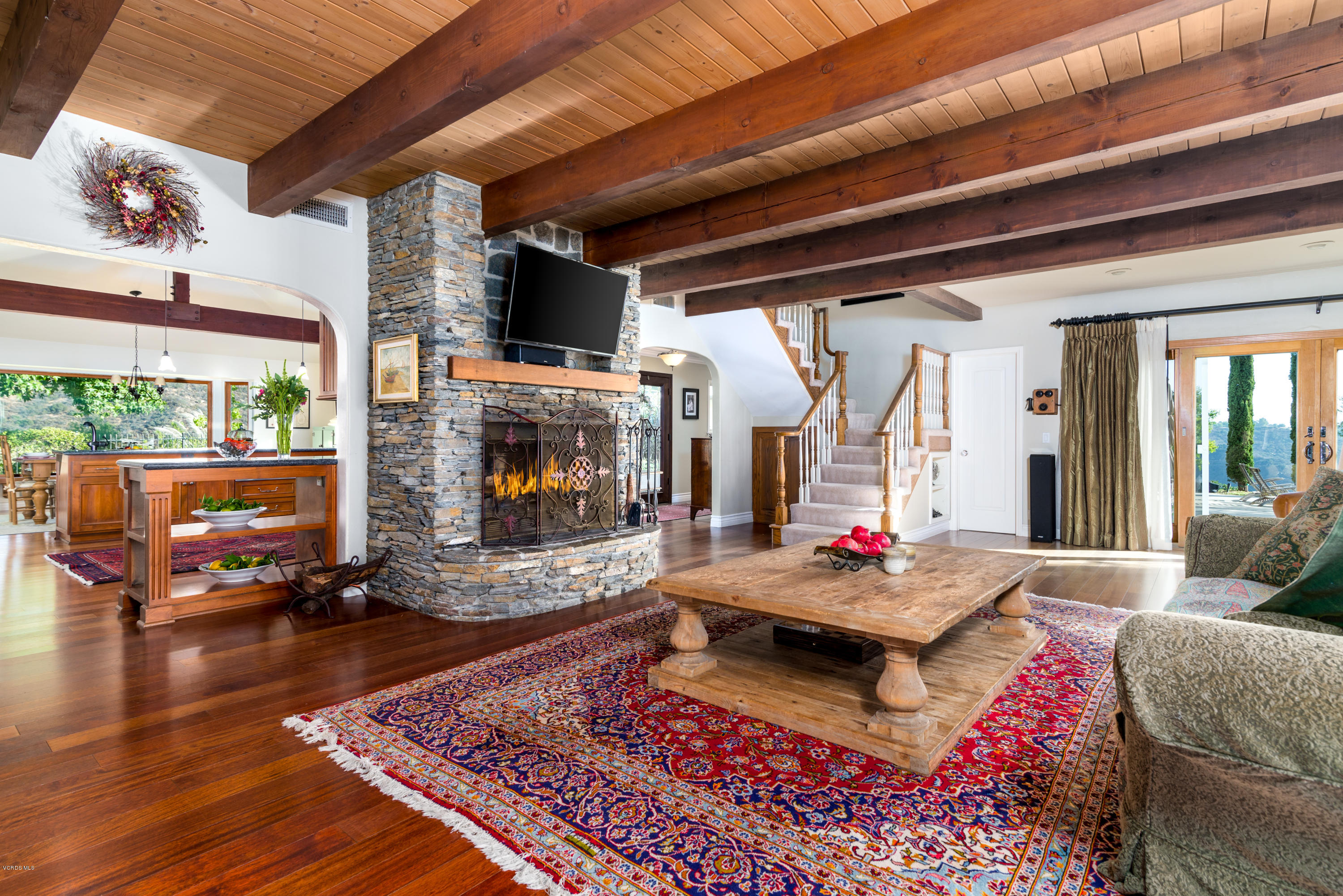 24353 Dry Canyon Cold Creek Road Calabasas, CA 91302 - Photo 16 of 36 a living room with furniture and a fireplace