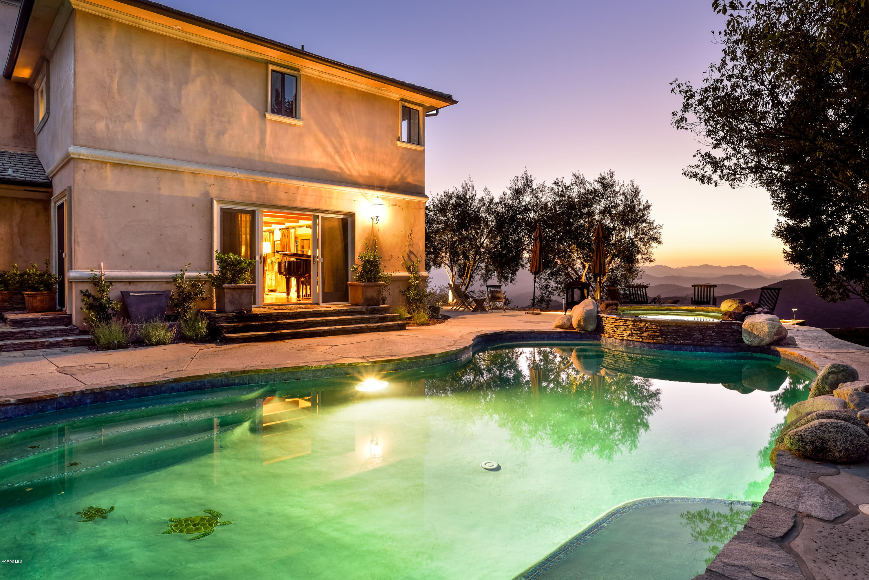 24353 Dry Canyon Cold Creek Road Calabasas, CA 91302 - Photo 3 of 36 a view of a house with swimming pool and sitting area