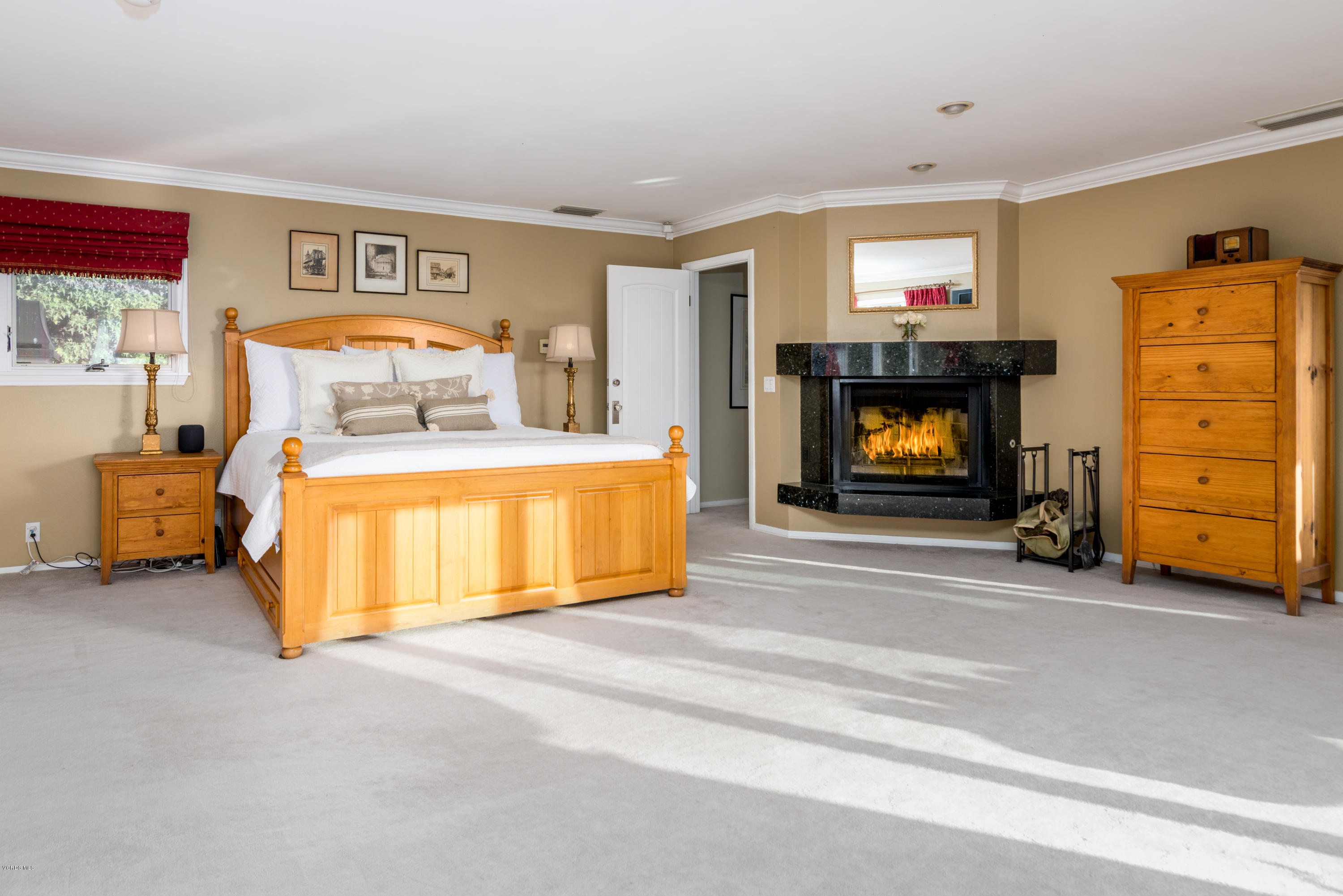 24353 Dry Canyon Cold Creek Road Calabasas, CA 91302 - Photo 23 of 36 a bedroom with a bed and wooden floor