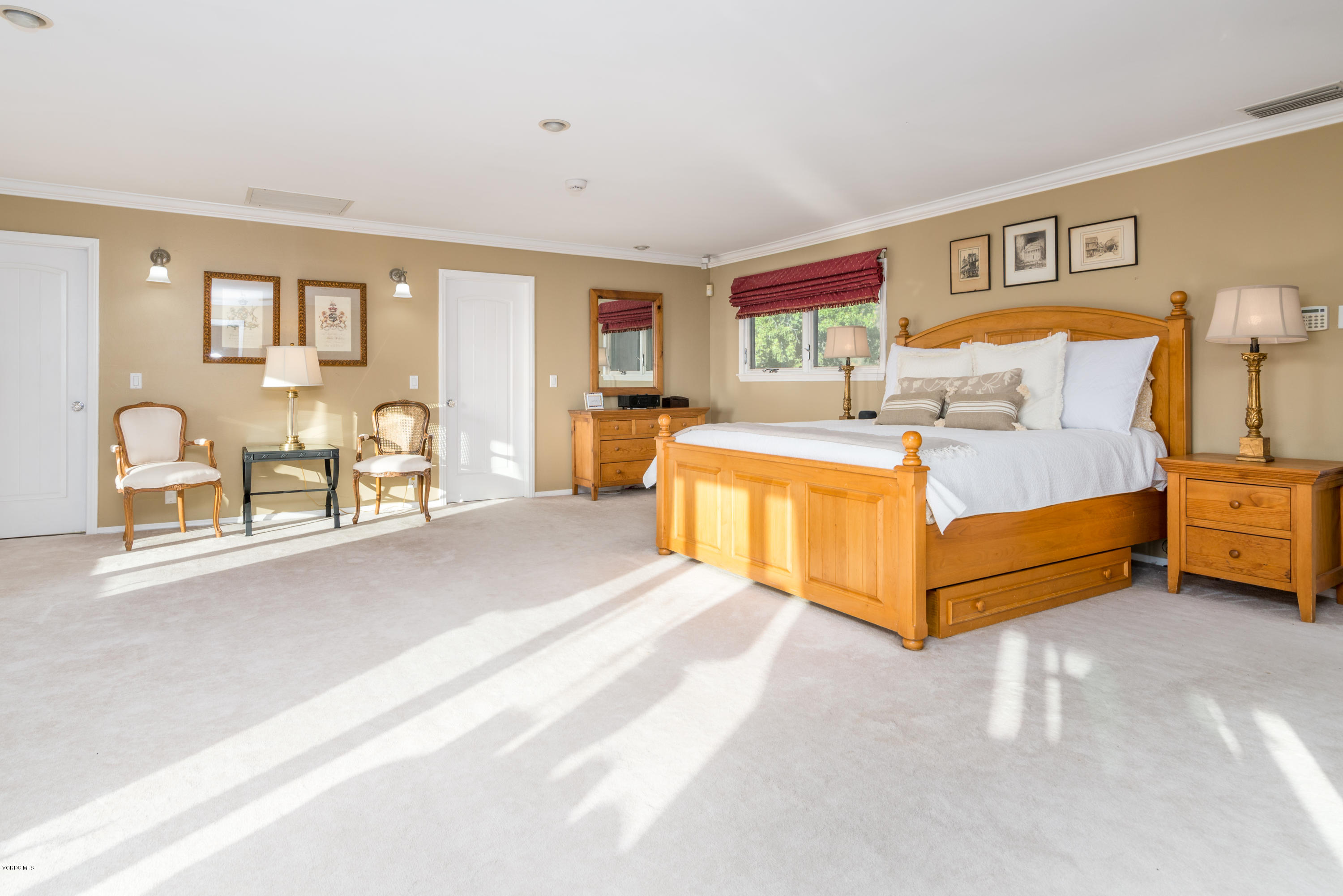 24353 Dry Canyon Cold Creek Road Calabasas, CA 91302 - Photo 25 of 36 a bedroom with a bed and ceiling fan