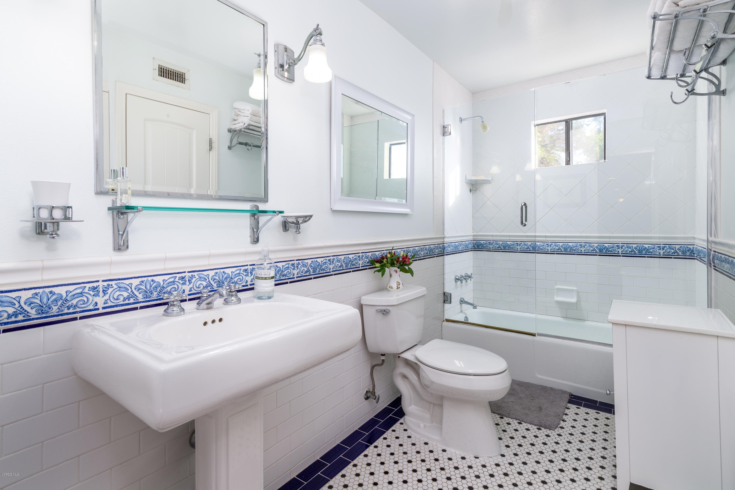 24353 Dry Canyon Cold Creek Road Calabasas, CA 91302 - Photo 29 of 36 a bathroom with a sink a toilet and a mirror