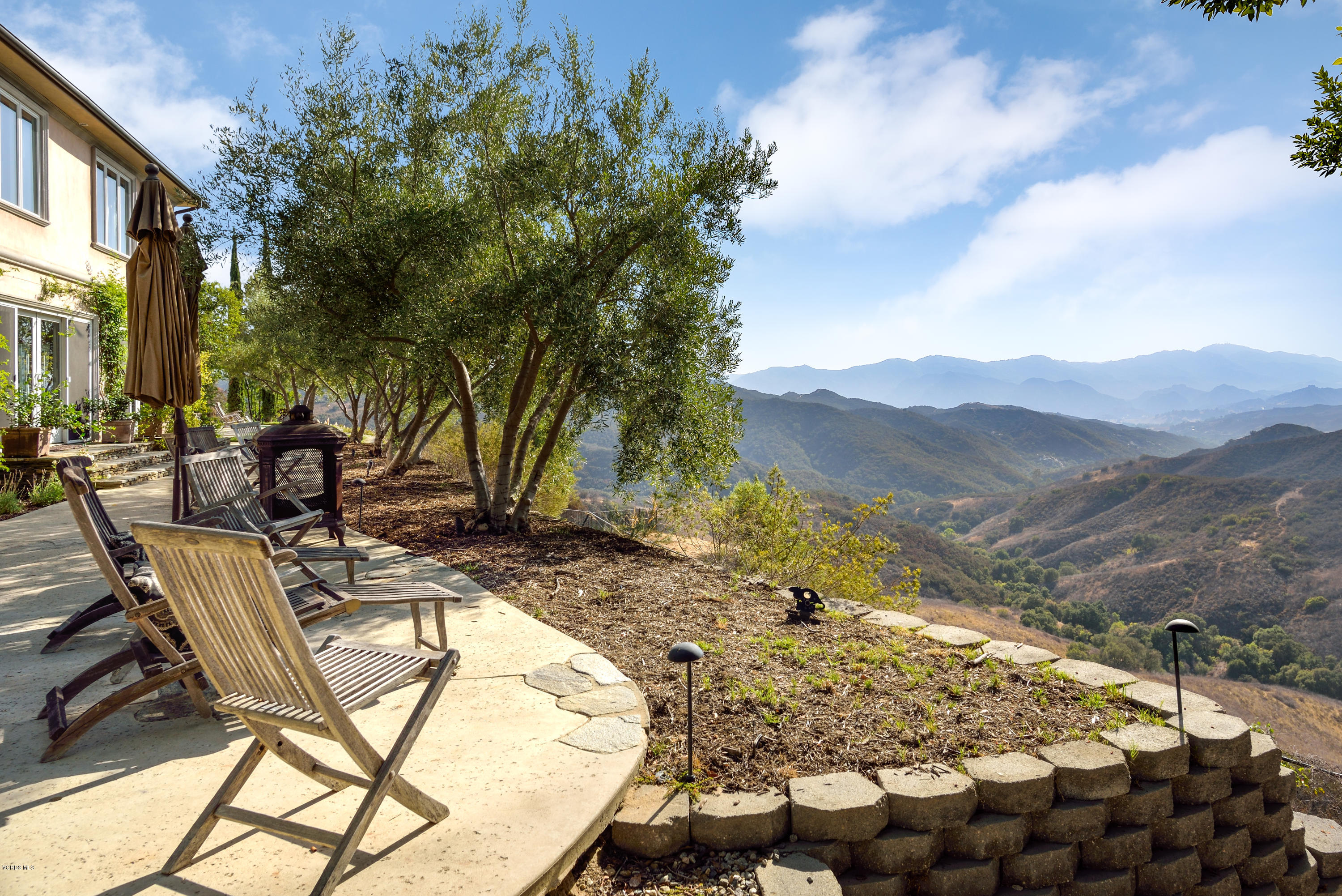 24353 Dry Canyon Cold Creek Road Calabasas, CA 91302 - Photo 4 of 36 a view of a backyard with sitting area