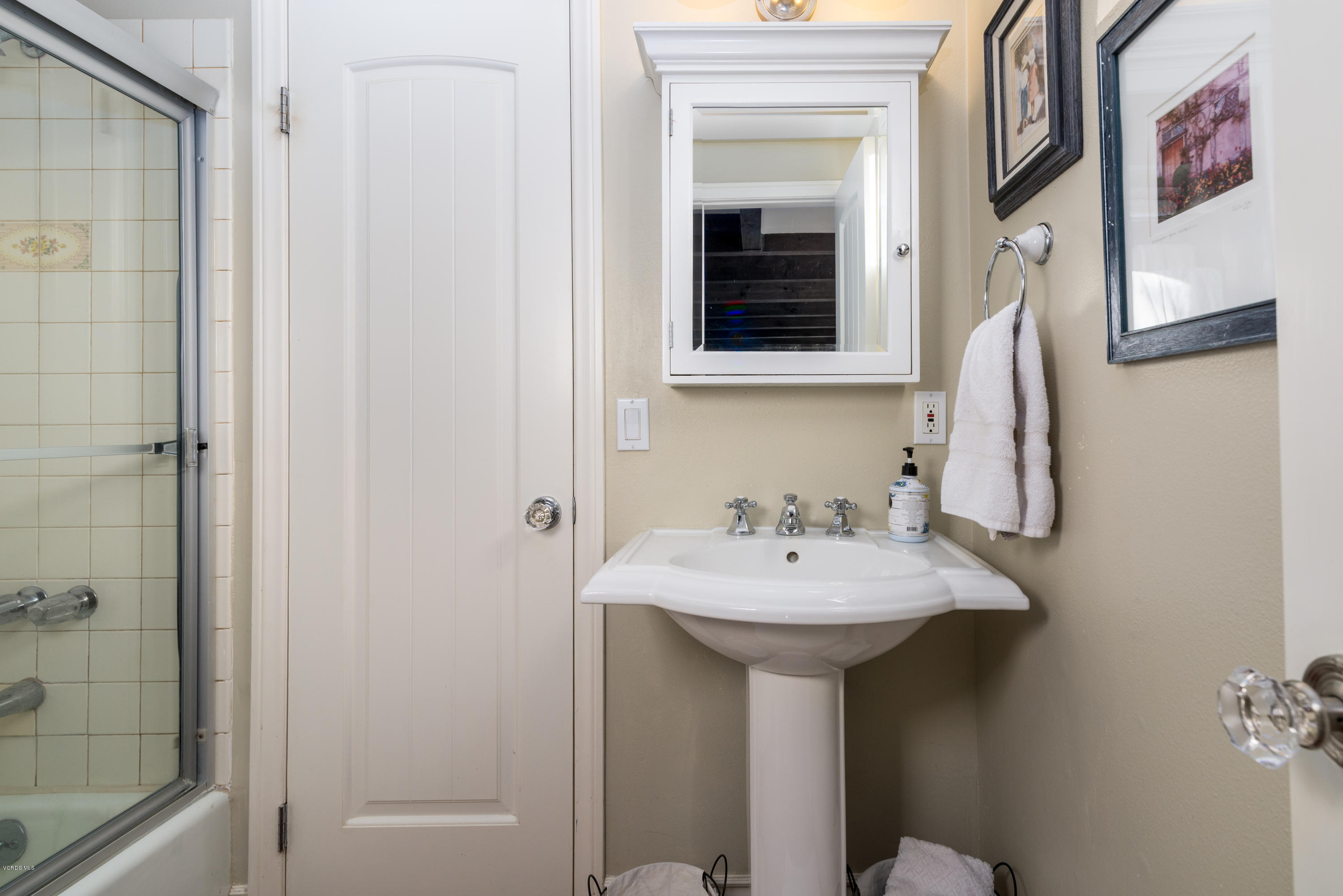 24353 Dry Canyon Cold Creek Road Calabasas, CA 91302 - Photo 32 of 36 a bathroom with a sink and mirror