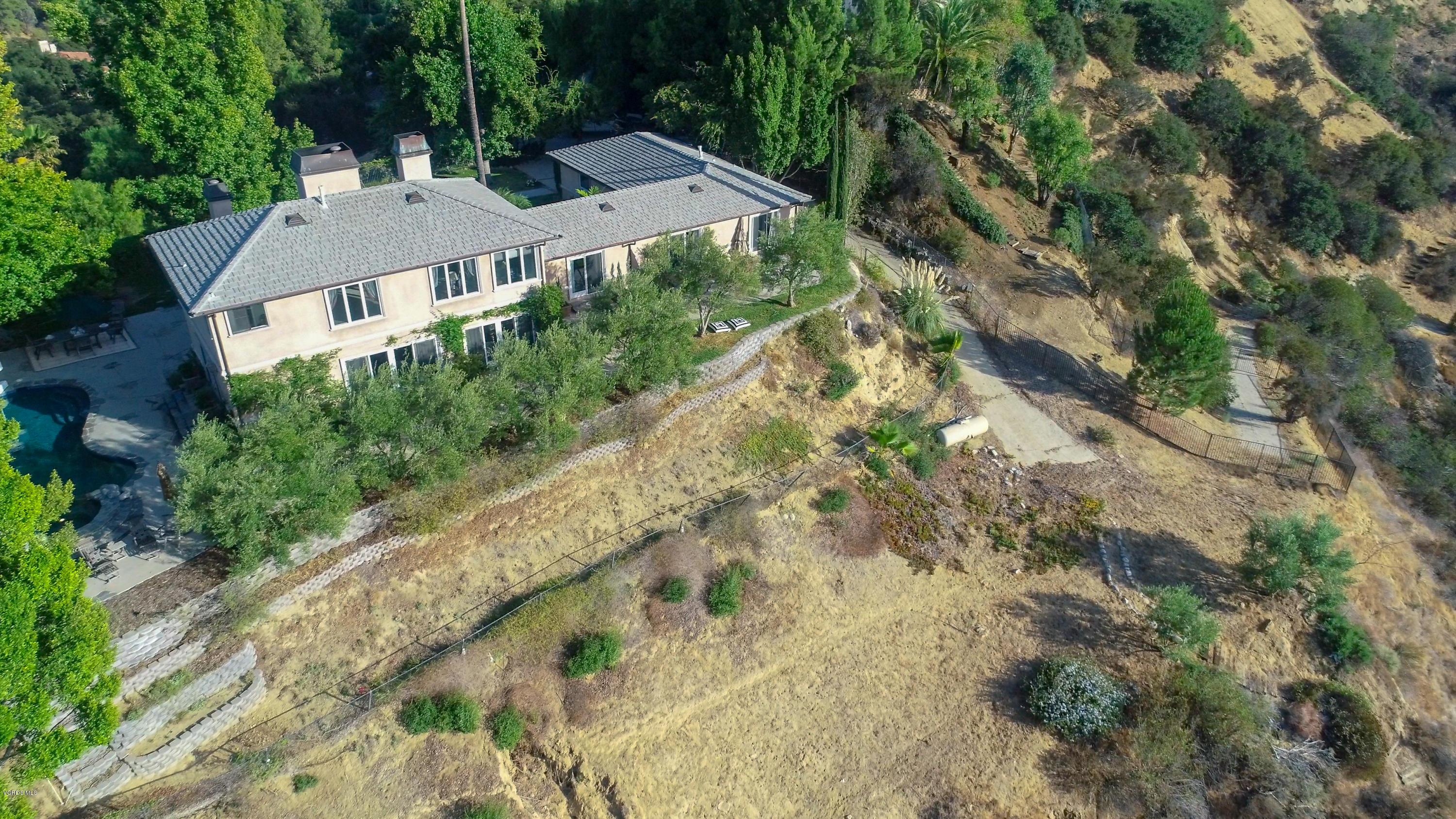 24353 Dry Canyon Cold Creek Road Calabasas, CA 91302 - Photo 34 of 36 an aerial view of residential houses with outdoor space