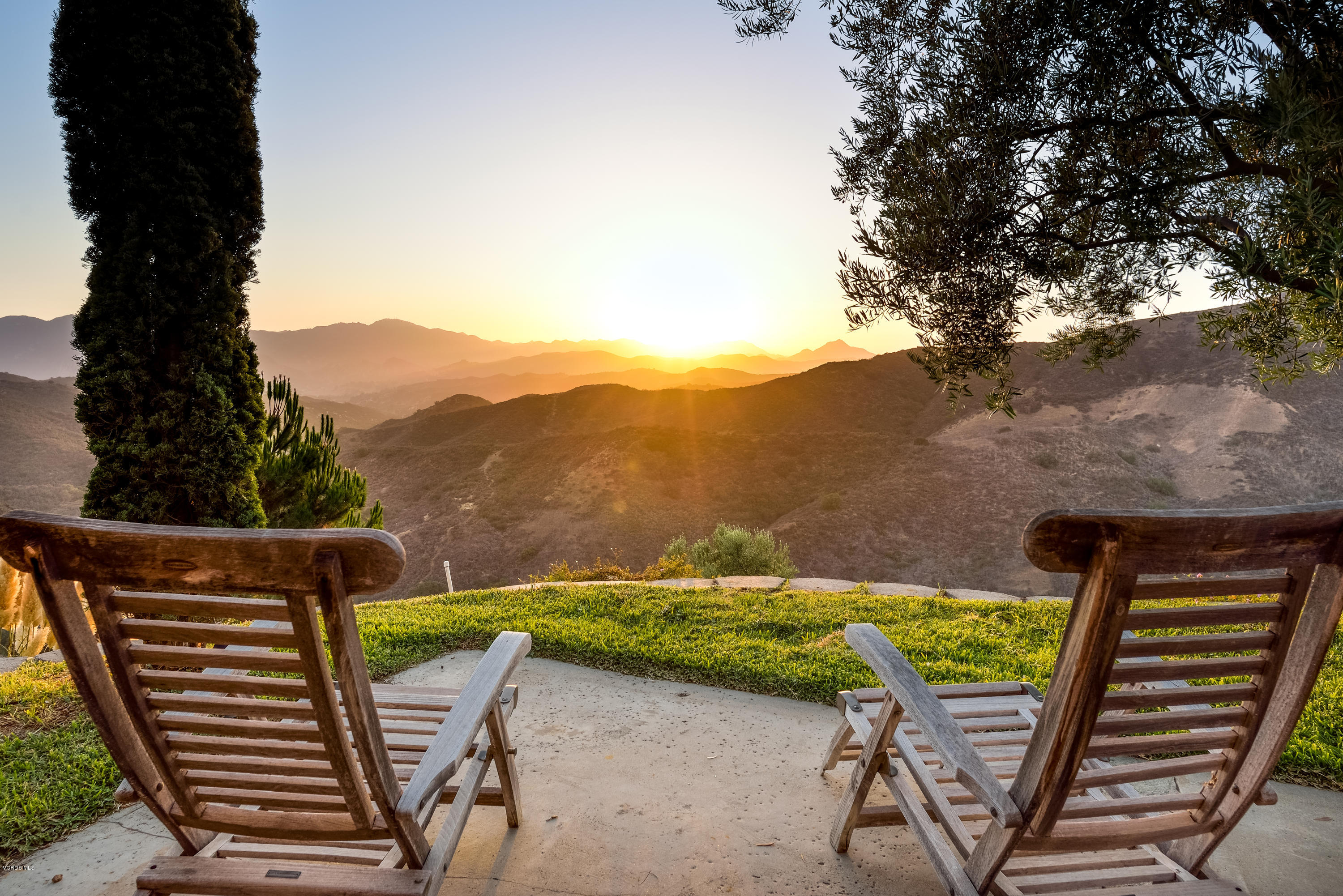 24353 Dry Canyon Cold Creek Road Calabasas, CA 91302 - Photo 8 of 36 a view of a chairs and table on the patio