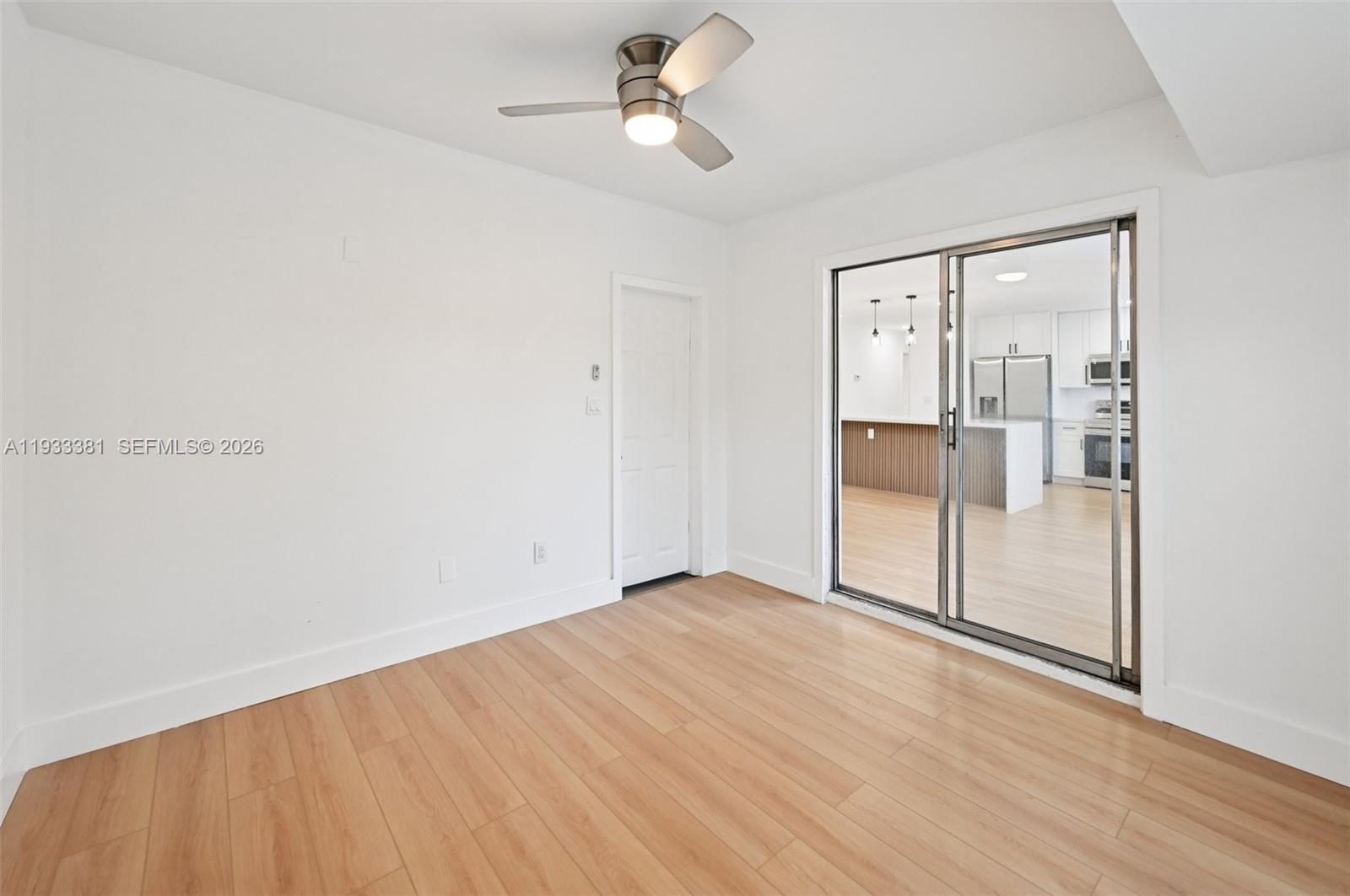 337 Southwest Cherryhill Road Port St. Lucie, FL 34953 - Photo 16 of 30 a view of empty room with wooden floor
