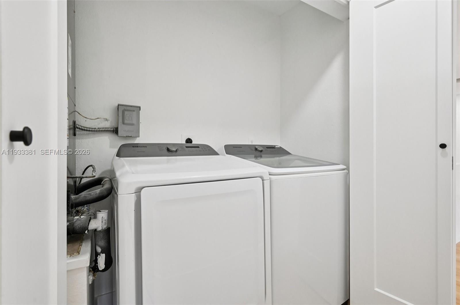 337 Southwest Cherryhill Road Port St. Lucie, FL 34953 - Photo 17 of 30 a utility room with dryer and washer