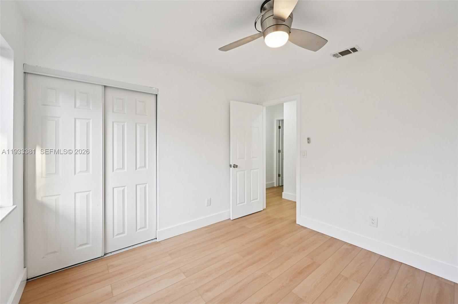 337 Southwest Cherryhill Road Port St. Lucie, FL 34953 - Photo 20 of 30 a view of empty room with wooden floor