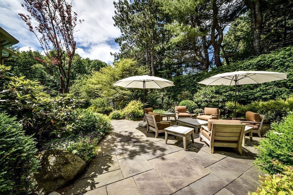 4 Folsoms Pond Road Wayland, MA 01778 - Photo 17 of 25 a patio with a patio table and chairs