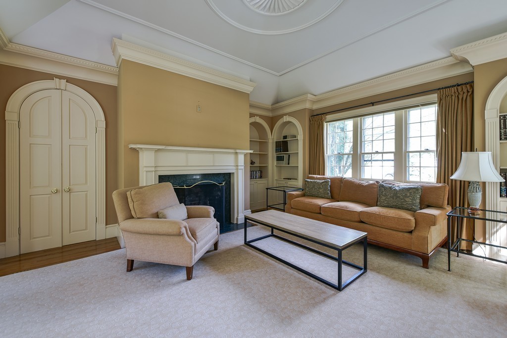 4 Folsoms Pond Road Wayland, MA 01778 - Photo 5 of 25 a living room with furniture and a fireplace