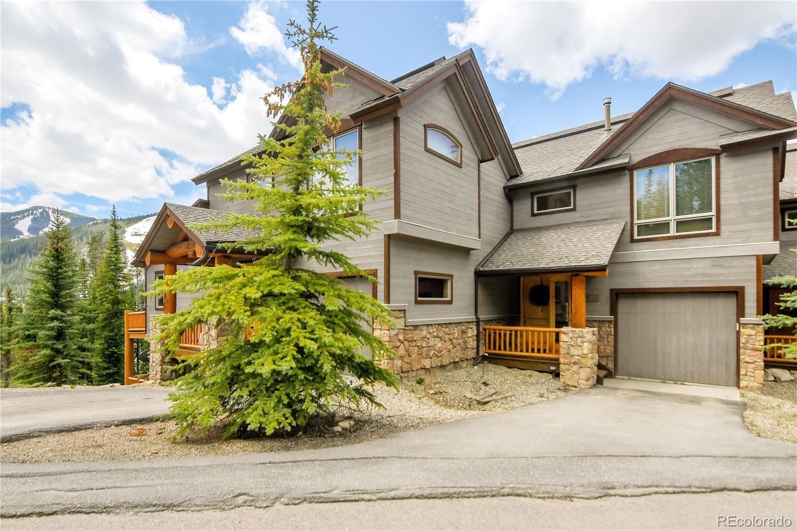 203 Antler Way, Unit 2203 Winter Park, CO 80482 - Photo 2 of 44 a front view of a house with a garden