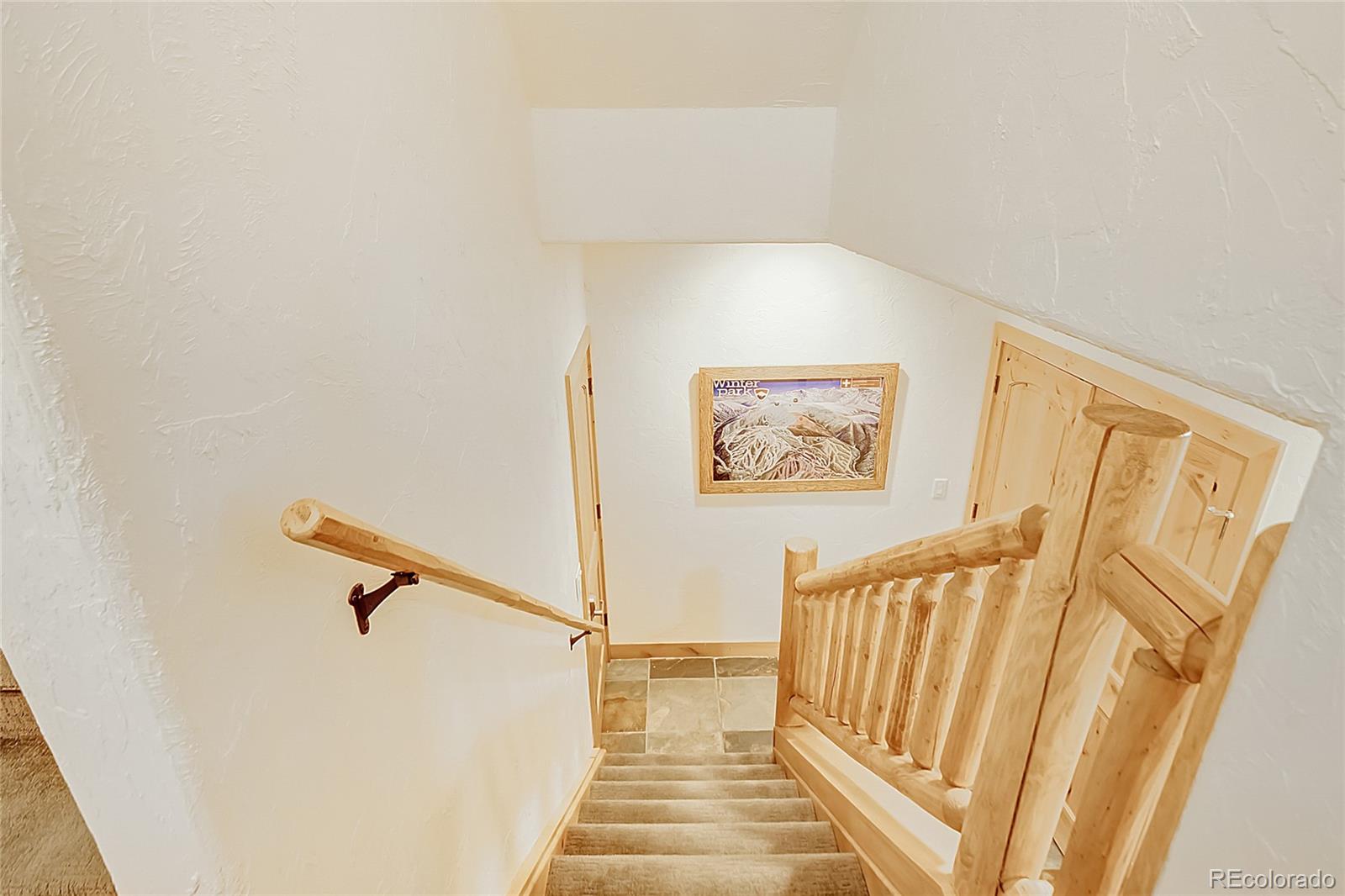 203 Antler Way, Unit 2203 Winter Park, CO 80482 - Photo 22 of 44 a view of a hallway with stairs