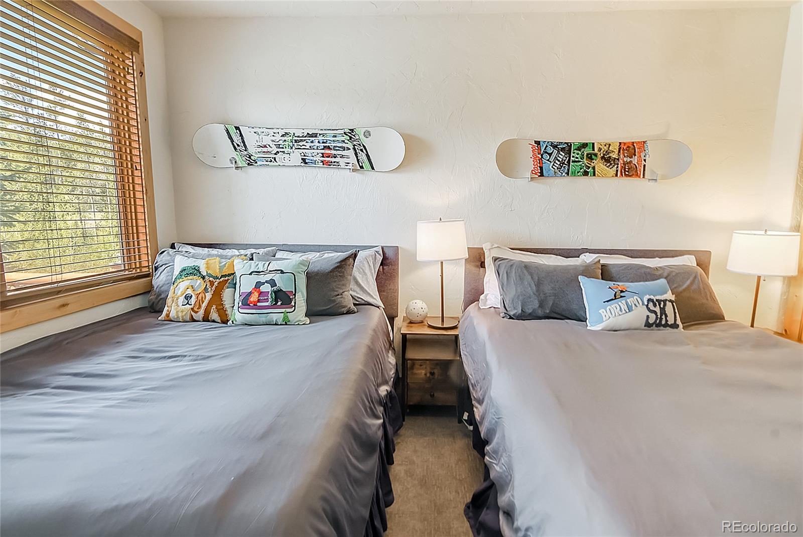 203 Antler Way, Unit 2203 Winter Park, CO 80482 - Photo 27 of 44 a bedroom with a bed and a window