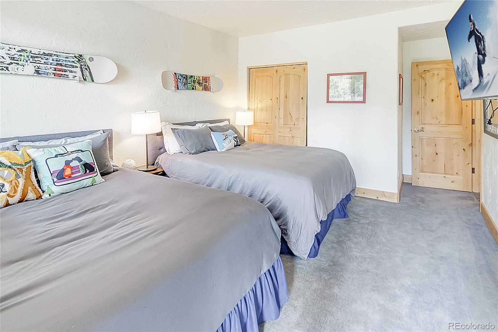203 Antler Way, Unit 2203 Winter Park, CO 80482 - Photo 28 of 44 a spacious bedroom with a bed and a couch