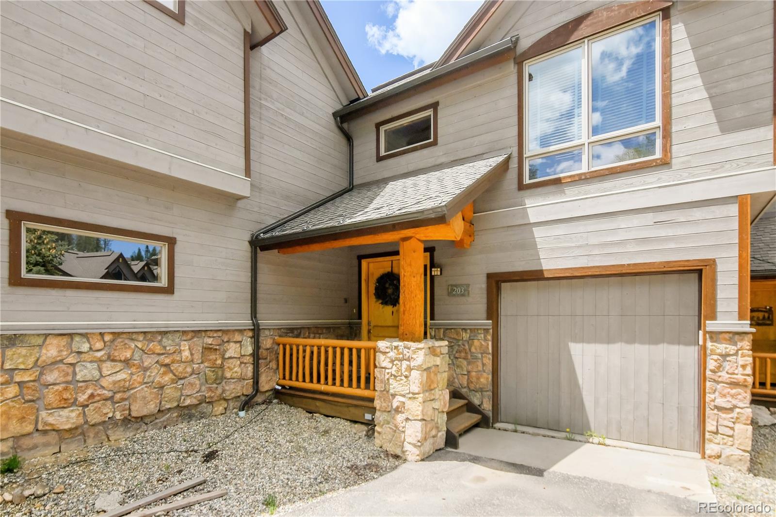 203 Antler Way, Unit 2203 Winter Park, CO 80482 - Photo 3 of 44 a front view of a house with stairs