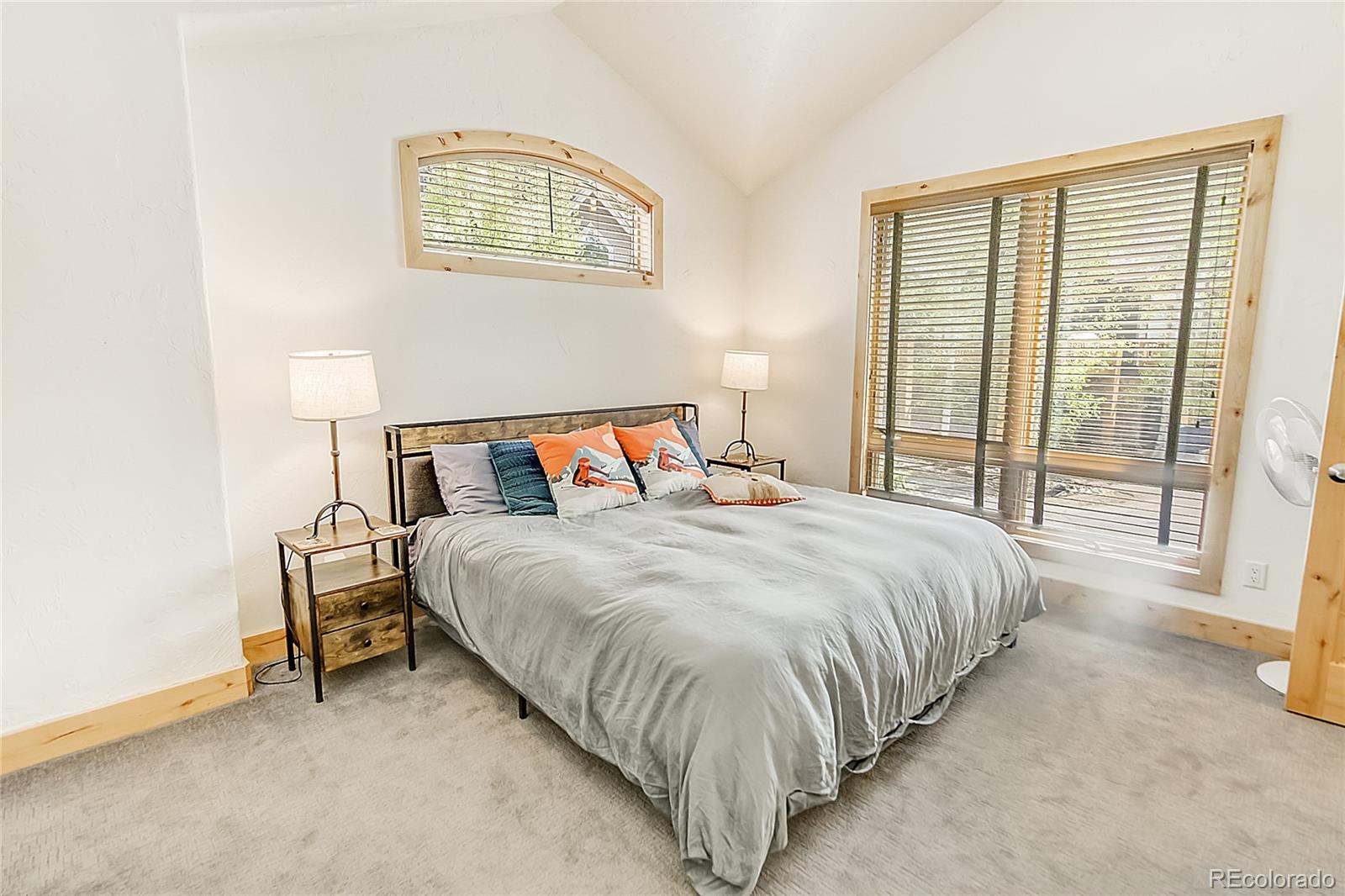 203 Antler Way, Unit 2203 Winter Park, CO 80482 - Photo 35 of 44 a bedroom with a bed and a night stand