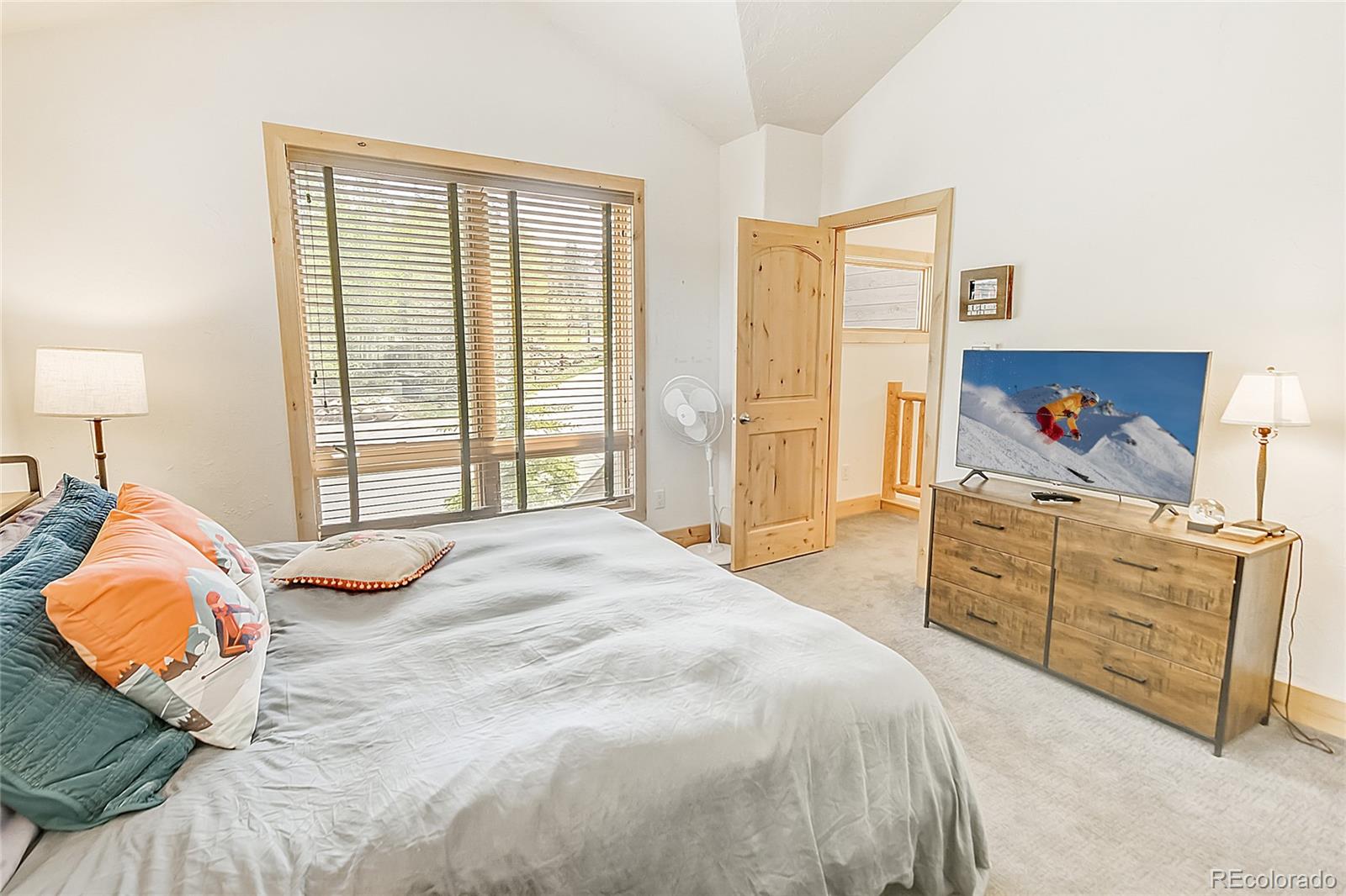 203 Antler Way, Unit 2203 Winter Park, CO 80482 - Photo 36 of 44 a bed room with a bed and a chair