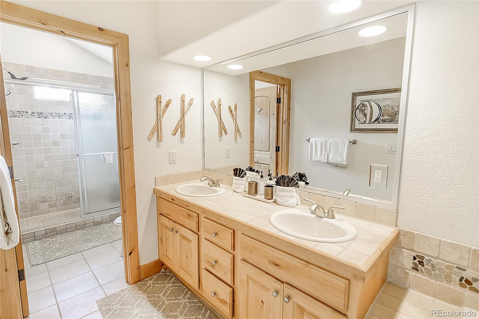 203 Antler Way, Unit 2203 Winter Park, CO 80482 - Photo 39 of 44 a bathroom with a sink double vanity and a shower