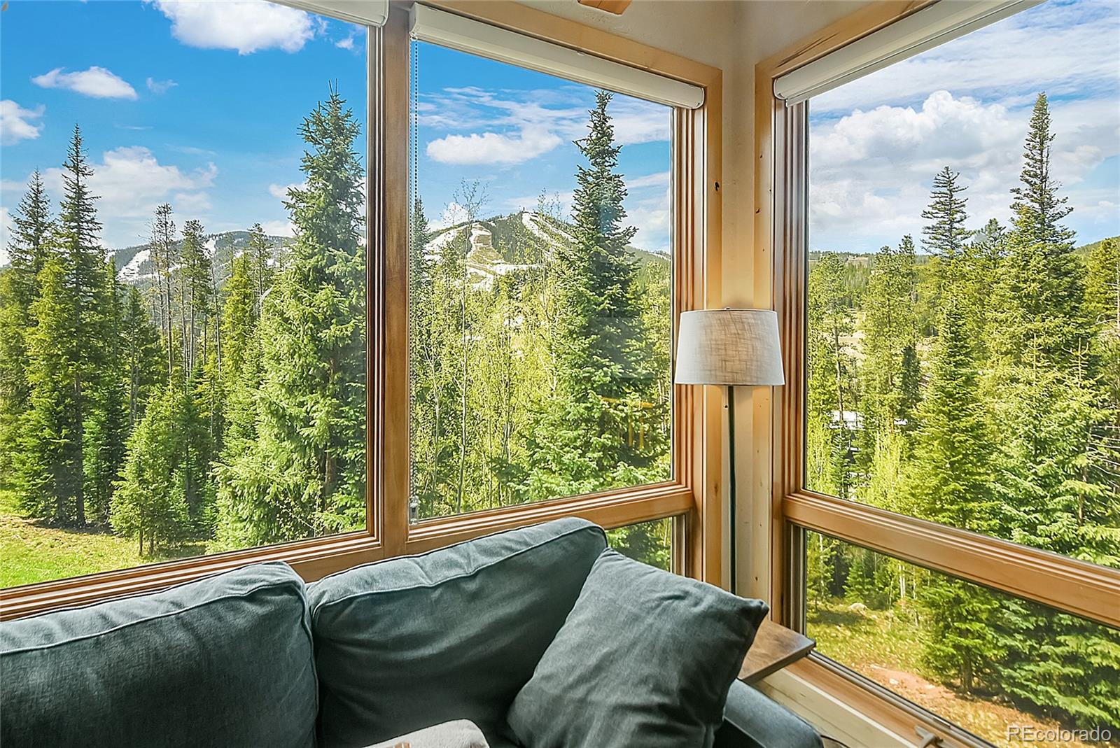 203 Antler Way, Unit 2203 Winter Park, CO 80482 - Photo 6 of 44 a view of a glass door and porch with couches