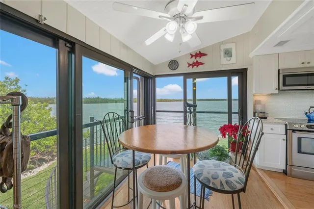 a view of a dining room with furniture window and outside view