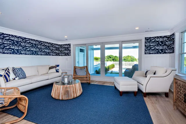 a view of swimming pool with outdoor seating and plants