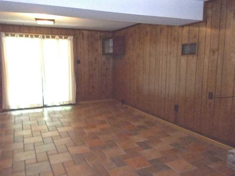 8918 Highland Road Pittsburgh, PA 15237 - Photo 18 of 25 Basement/Game Room. Walkout Paneled game room with newer ceramic tile flooring, sliding glass doors to a deck.