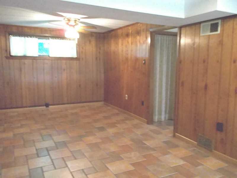 8918 Highland Road Pittsburgh, PA 15237 - Photo 19 of 25 Basement/Game Room. Another view of the gameroom with a window and ceiling fan!