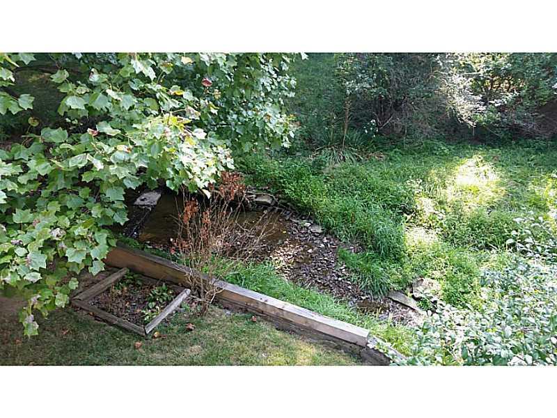 8918 Highland Road Pittsburgh, PA 15237 - Photo 24 of 25 Exterior Back. View of creek from deck.