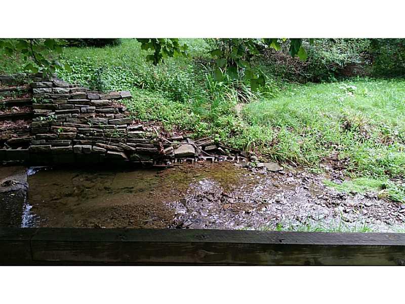 8918 Highland Road Pittsburgh, PA 15237 - Photo 25 of 25 Exterior Back. Shallow creek.