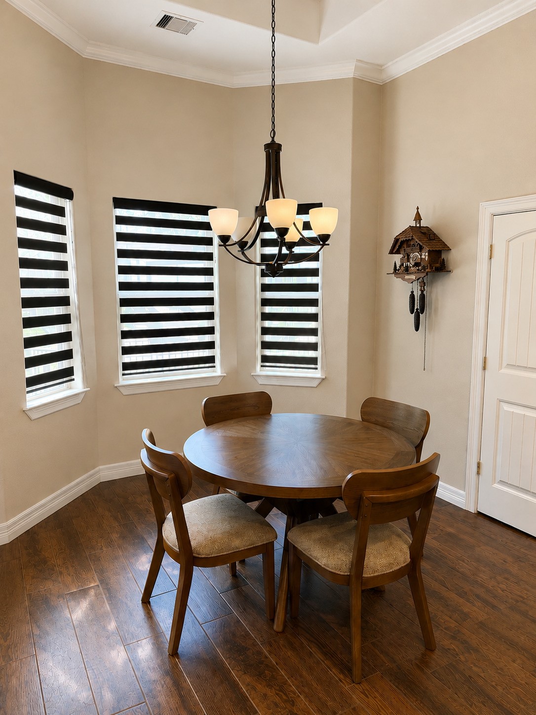 27656 Rio Blanco Drive Splendora, TX 77372 - Photo 8 of 18 You'll enjoy time here while overlooking your backyard oasis. Neutral colors, wood-look flooring enhanced by the beautiful recessed tray ceiling bordered with classic white crown molding and a dark bronze five-light chandelier.