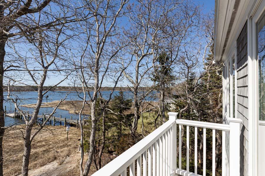 99 Monomoscoy Road West Mashpee, MA 02649 - Photo 21 of 43 a view of a balcony with wooden fence